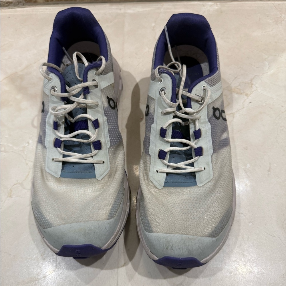 On Running White and Purple Sneakers